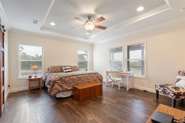 bedroom featuring a tray ceiling, visible vents, ornamental molding, and multiple windows