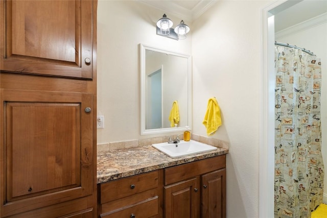 bathroom featuring crown molding, a shower with shower curtain, and vanity