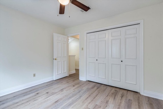 13109 Marble Falls Cv, Austin, TX 78729 - unfurnished bedroom featuring wood finished floors, a closet, baseboards, and a ceiling fan