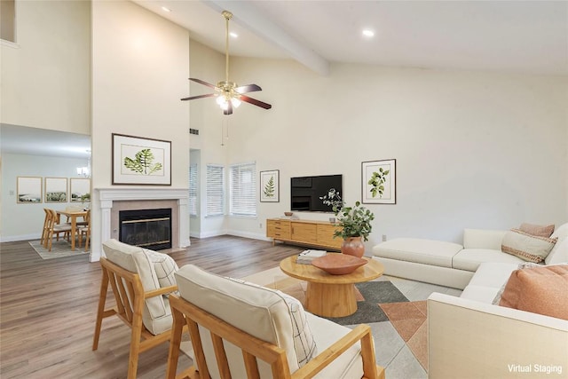 13109 Marble Falls Cv, Austin, TX 78729 - living area featuring wood finished floors, high vaulted ceiling, a ceiling fan, beam ceiling, and recessed lighting