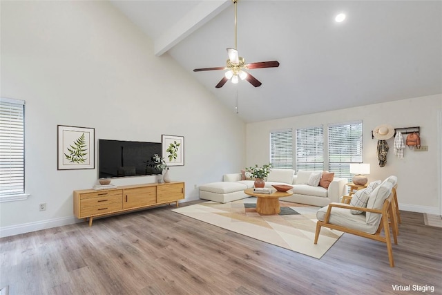 13109 Marble Falls Cv, Austin, TX 78729 - living area with high vaulted ceiling, ceiling fan, baseboards, light wood-style floors, and beam ceiling