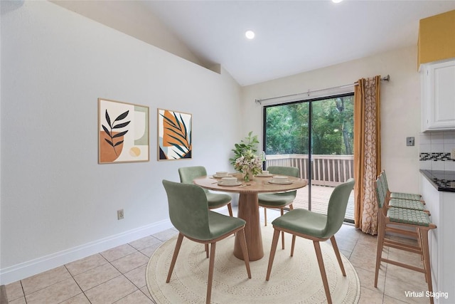 dining space featuring light tile patterned flooring, baseboards, recessed lighting, and lofted ceiling
