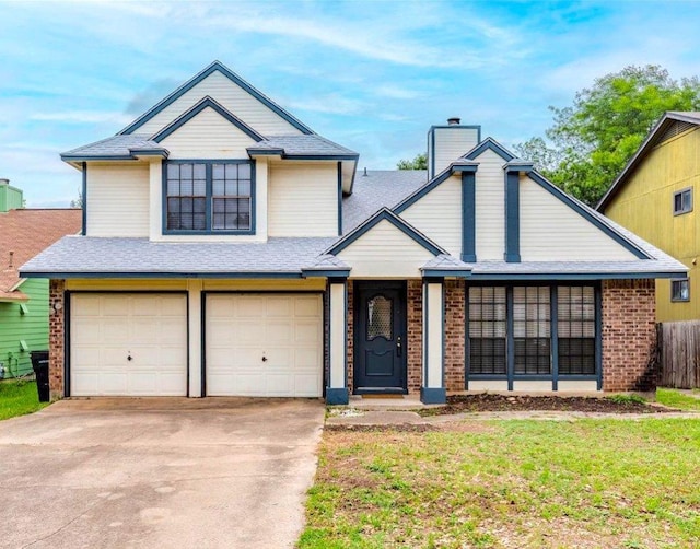 traditional-style home with fence, a chimney, brick siding, concrete driveway, and an attached garage