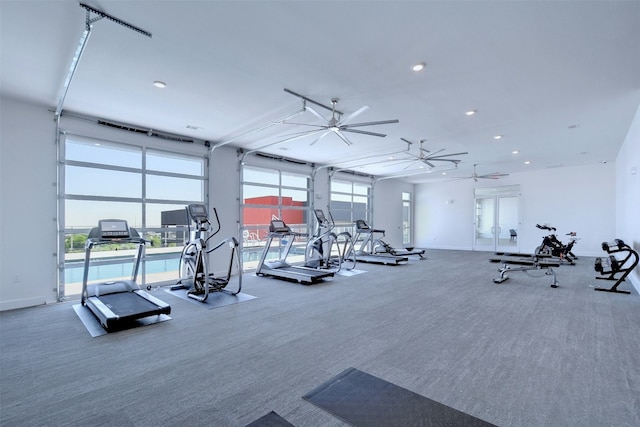 exercise room featuring a healthy amount of sunlight, baseboards, carpet flooring, and recessed lighting