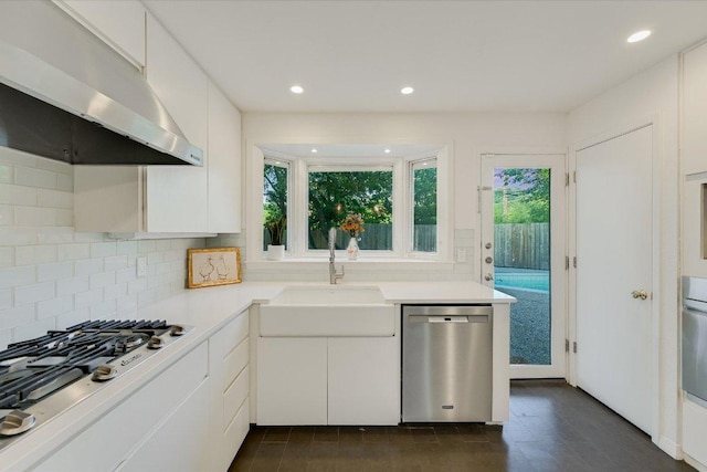 3514 Lakeland Dr, Austin, TX 78731 - kitchen featuring appliances with stainless steel finishes, under cabinet range hood, healthy amount of natural light, light countertops, and recessed lighting