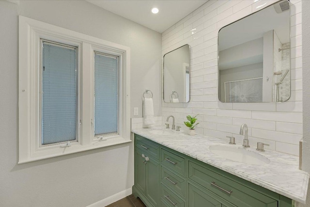 3514 Lakeland Dr, Austin, TX 78731 - bathroom featuring double vanity, tasteful backsplash, baseboards, and a shower