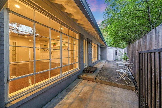 3514 Lakeland Dr, Austin, TX 78731 - property exterior at dusk featuring a patio and fence
