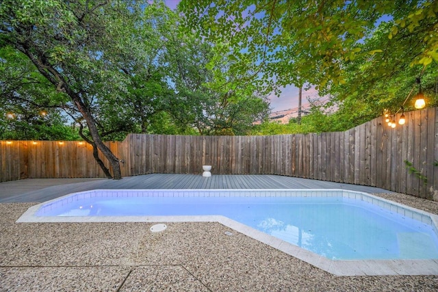 3514 Lakeland Dr, Austin, TX 78731 - view of swimming pool with a wooden deck and a fenced backyard