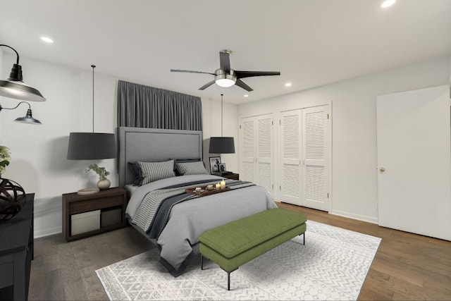 3514 Lakeland Dr, Austin, TX 78731 - bedroom featuring baseboards, multiple closets, recessed lighting, and wood finished floors