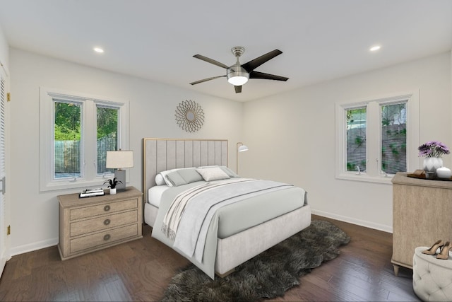 3514 Lakeland Dr, Austin, TX 78731 - bedroom with multiple windows, dark wood finished floors, baseboards, and recessed lighting