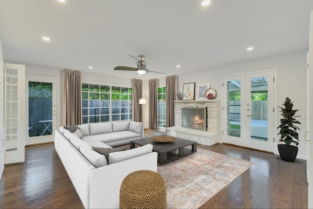 3514 Lakeland Dr, Austin, TX 78731 - living room featuring french doors, dark wood-style floors, recessed lighting, a ceiling fan, and a stone fireplace