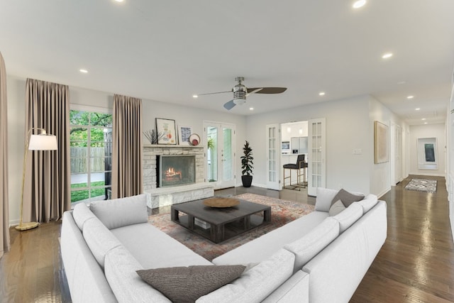 3514 Lakeland Dr, Austin, TX 78731 - living area featuring a fireplace, wood finished floors, recessed lighting, ceiling fan, and french doors