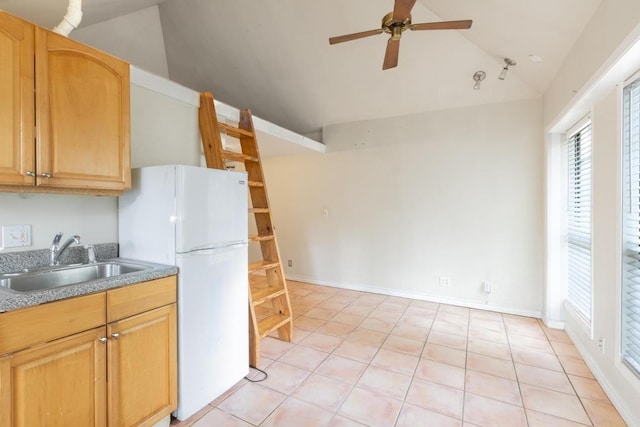 kitchen featuring ceiling fan, open shelves, a sink, freestanding refrigerator, and vaulted ceiling