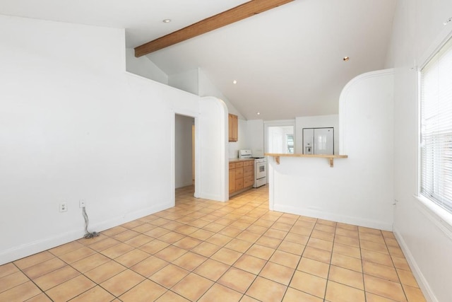 unfurnished living room featuring light tile patterned floors and vaulted ceiling with beams
