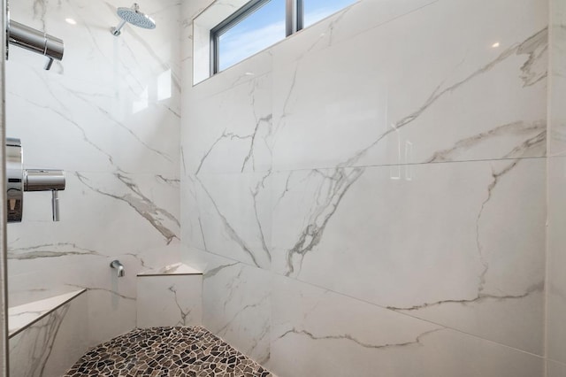 bathroom with a marble finish shower