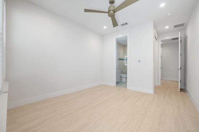 unfurnished bedroom featuring recessed lighting, visible vents, ensuite bathroom, and light wood-style floors