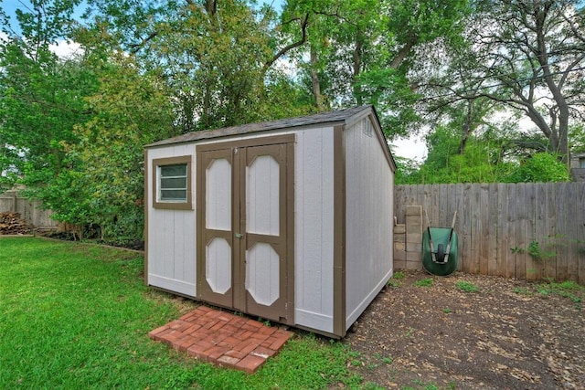view of shed with a fenced backyard