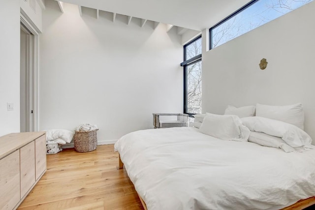bedroom featuring light wood-style floors