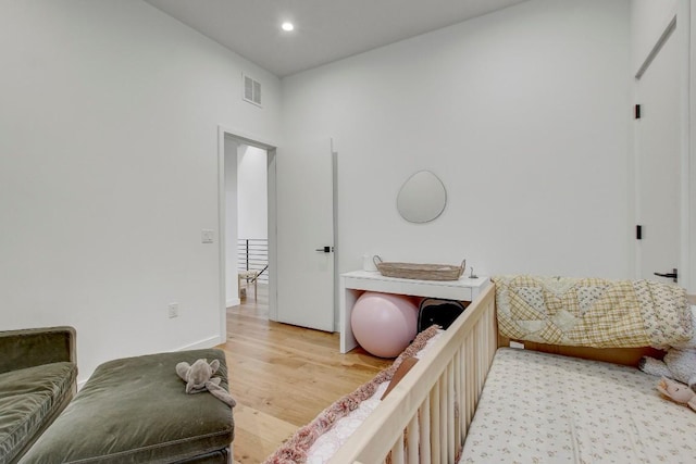bedroom featuring visible vents, recessed lighting, and light wood-style floors