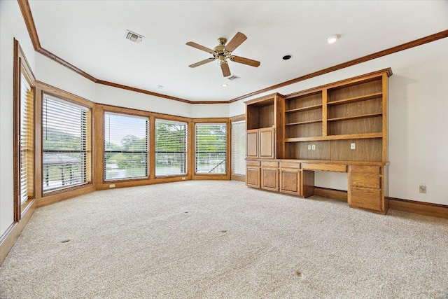 640 Woodlake Dr, Mcqueeney, TX 78123 - unfurnished living room with built in study area, ornamental molding, light carpet, and visible vents