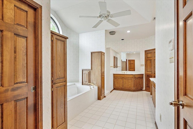 640 Woodlake Dr, Mcqueeney, TX 78123 - bathroom featuring tile patterned flooring, vanity, a ceiling fan, wallpapered walls, and a garden tub