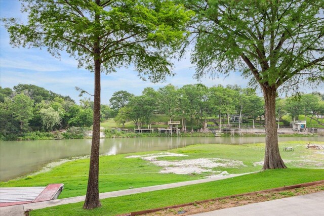 640 Woodlake Dr, Mcqueeney, TX 78123 - view of property's community with a lawn and a water view