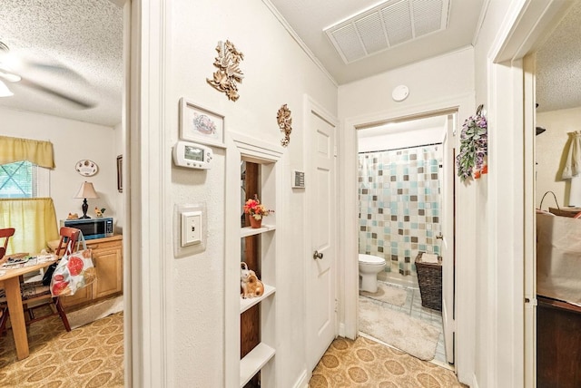 8409 Bowling Green Dr, Austin, TX 78757 - bathroom with curtained shower, a textured ceiling, and tile patterned floors