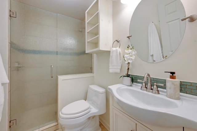 full bath featuring toilet, a shower stall, and vanity