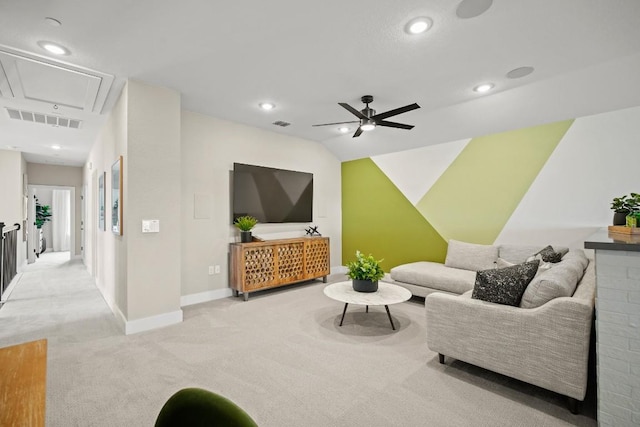 living room with light colored carpet, attic access, a ceiling fan, baseboards, and visible vents