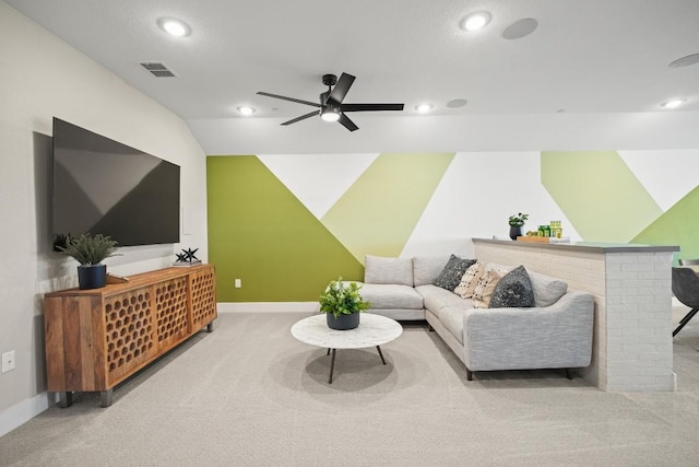 carpeted living room with visible vents, a ceiling fan, vaulted ceiling, and recessed lighting