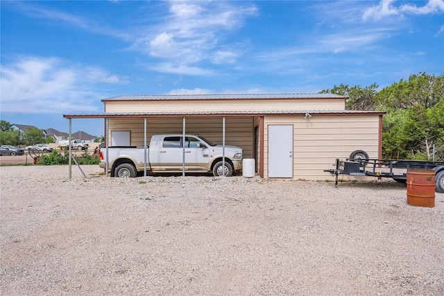 view of outbuilding featuring a carport