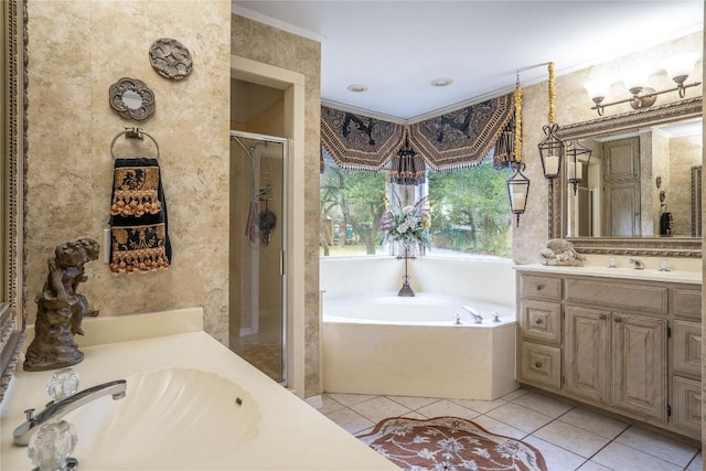 full bathroom featuring vanity, ornamental molding, a garden tub, tile patterned floors, and a shower stall