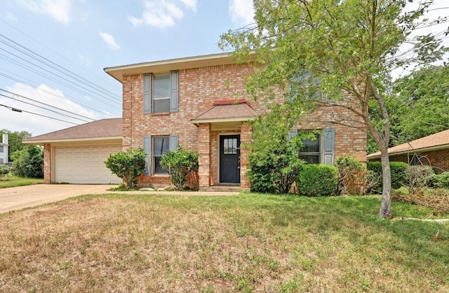 view of front facade with brick siding, a front lawn, an attached garage, and driveway