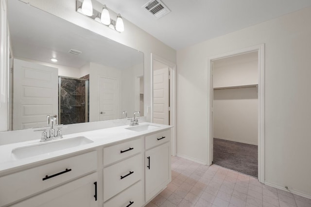 3944 Tufino Ln, Round Rock, TX 78665 - full bathroom featuring a shower stall, baseboards, visible vents, and a sink