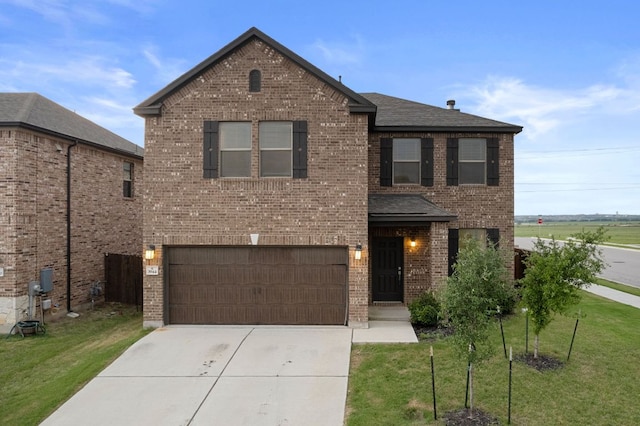 3944 Tufino Ln, Round Rock, TX 78665 - traditional-style house with an attached garage, brick siding, concrete driveway, a front lawn, and a shingled roof