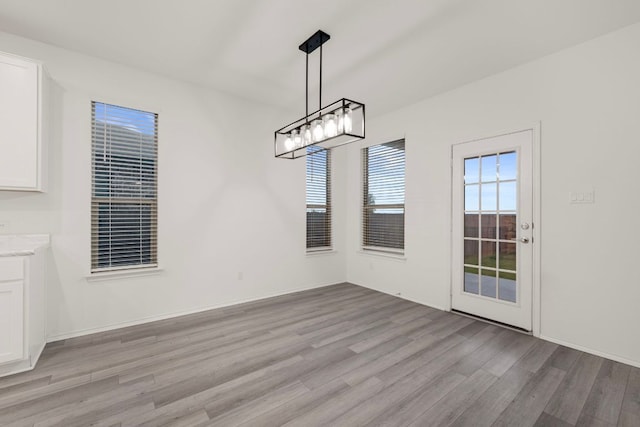 3944 Tufino Ln, Round Rock, TX 78665 - unfurnished dining area with light wood finished floors and baseboards