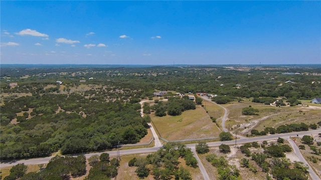 aerial view featuring a wooded view