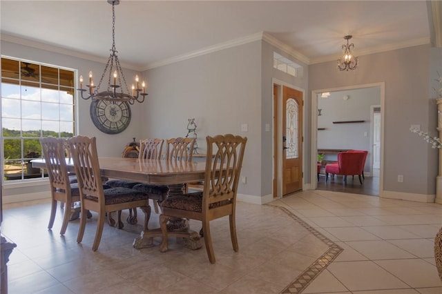dining space with an inviting chandelier, light tile patterned floors, and ornamental molding