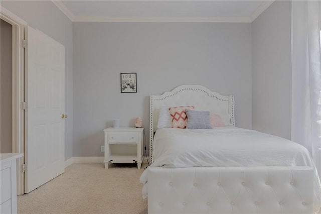 bedroom featuring baseboards, ornamental molding, and light carpet