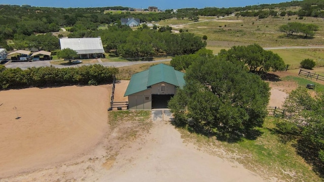 birds eye view of property with a rural view