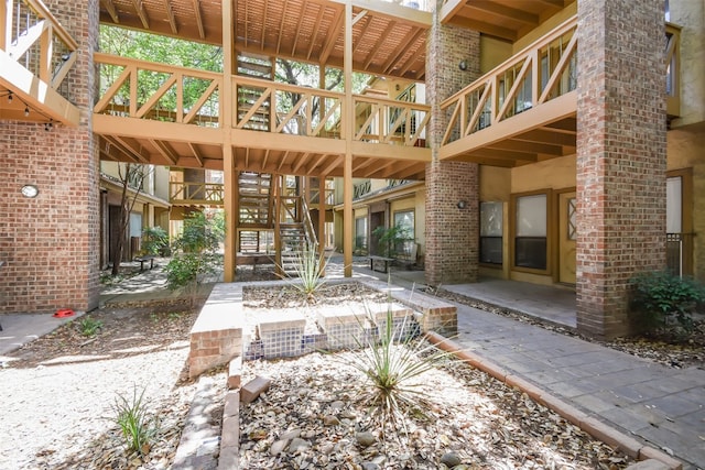 exterior space featuring a patio and stairs