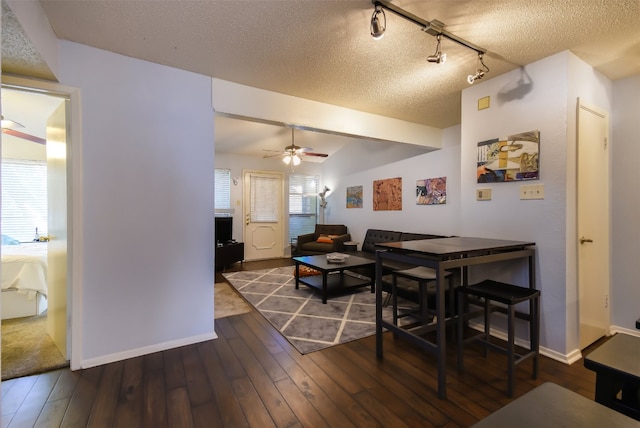 dining room with a textured ceiling, ceiling fan, and hardwood / wood-style flooring