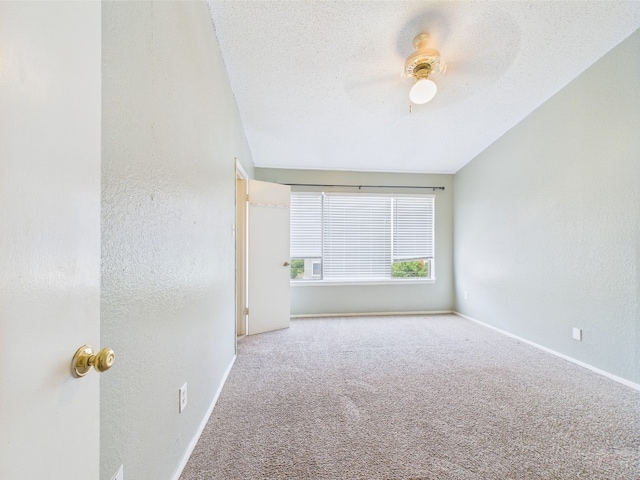 806 W 24th St Unit 312, Austin, TX 78705 - spare room with carpet, baseboards, a textured wall, and ceiling fan