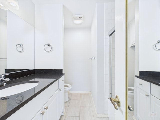 806 W 24th St Unit 312, Austin, TX 78705 - full bathroom featuring toilet, vanity, a shower, and tile patterned floors