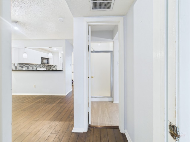 806 W 24th St Unit 312, Austin, TX 78705 - hall featuring hardwood / wood-style flooring and baseboards