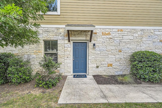 516 E Slaughter Ln Unit 1101, Austin, TX 78744 - doorway to property featuring stone siding