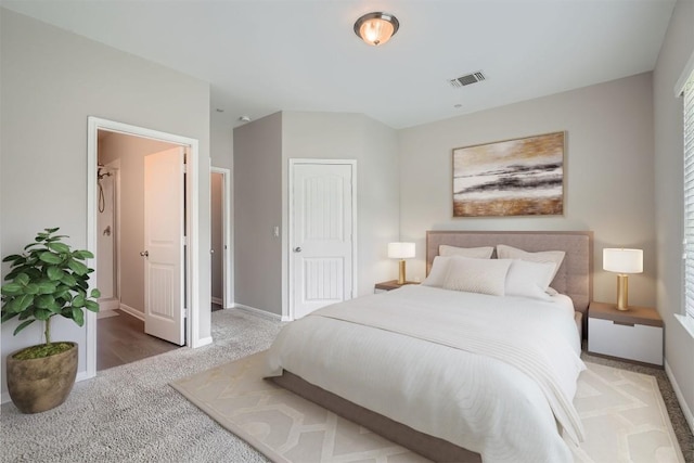 516 E Slaughter Ln Unit 1101, Austin, TX 78744 - carpeted bedroom featuring baseboards and visible vents