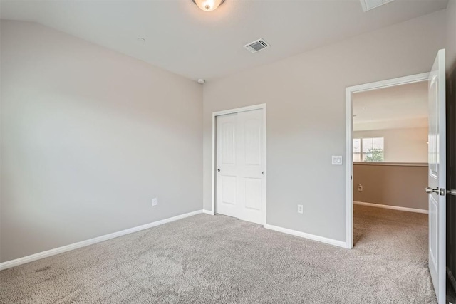 516 E Slaughter Ln Unit 1101, Austin, TX 78744 - unfurnished bedroom featuring a closet, baseboards, carpet flooring, and visible vents