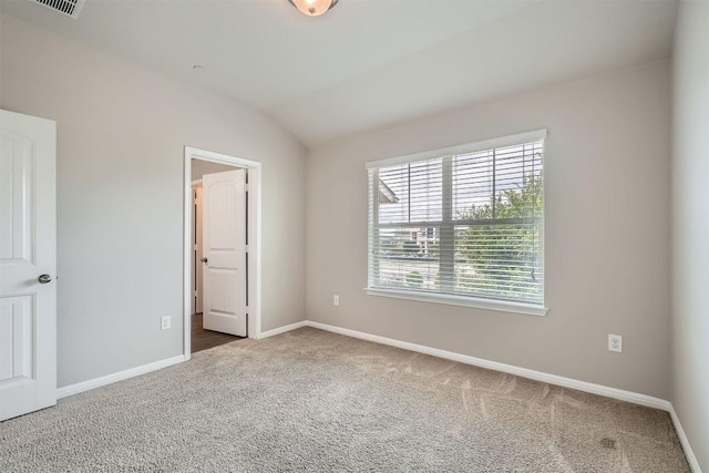 516 E Slaughter Ln Unit 1101, Austin, TX 78744 - unfurnished bedroom with baseboards, carpet flooring, and vaulted ceiling