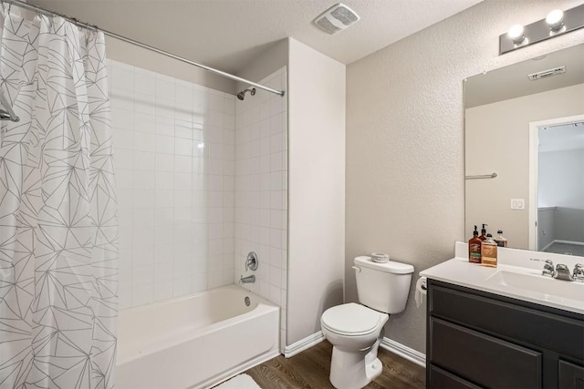 516 E Slaughter Ln Unit 1101, Austin, TX 78744 - full bathroom with visible vents, a textured wall, wood finished floors, and toilet